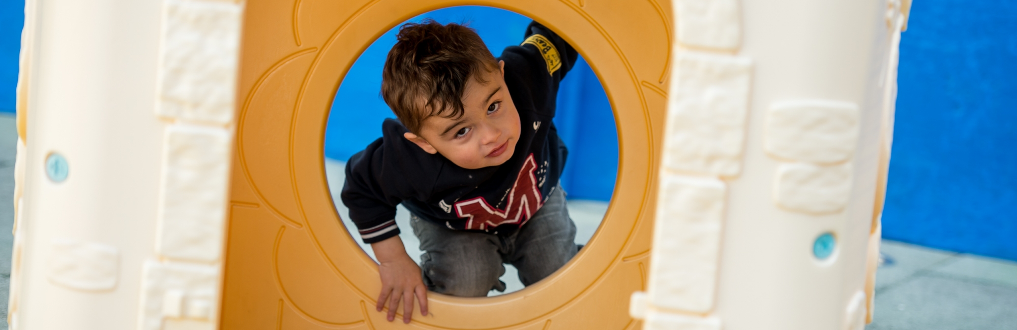 Child in Childcare outdoor area